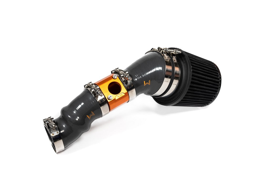 A performance short ram intake system for a Honda Civic or Acura Integra, featuring black piping and a orange-colored billet aluminum MAF housing.