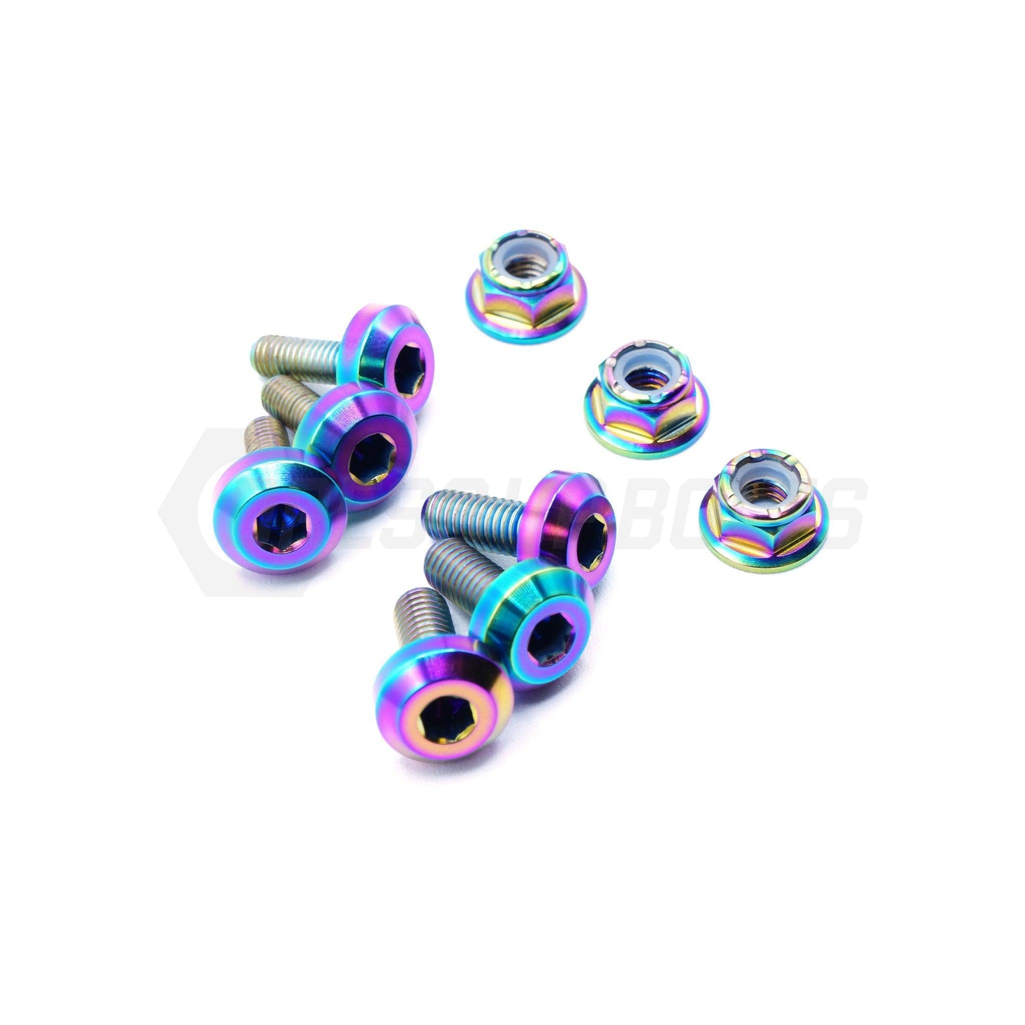 Multicolored screws on a white background