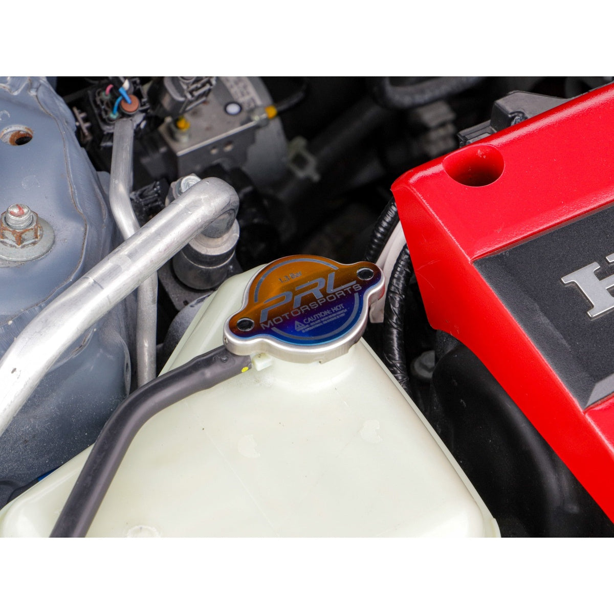 Engine bay view with PRL titanium radiator cap installed
