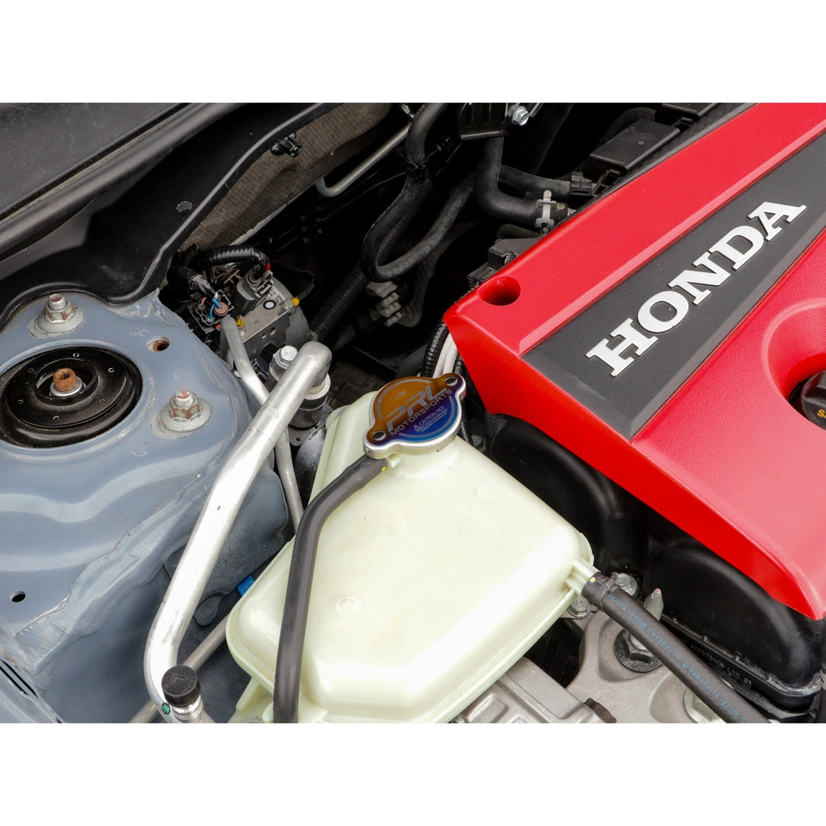 Wider engine bay shot showing PRL radiator cap