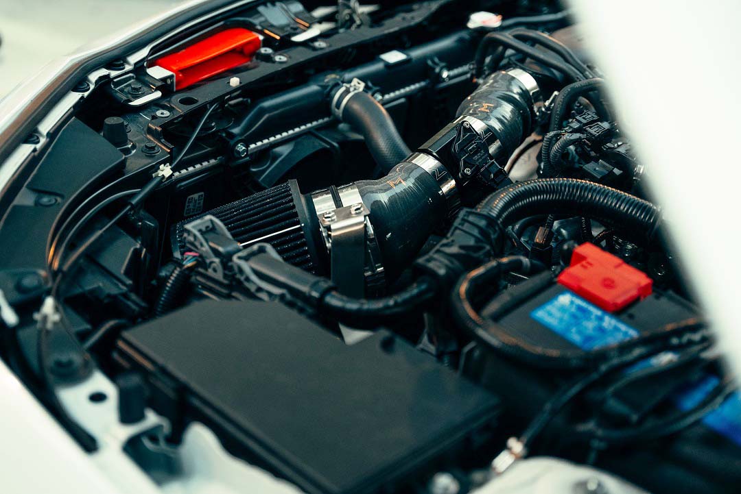 Short ram intake system laid out with tubing, filter, and couplers