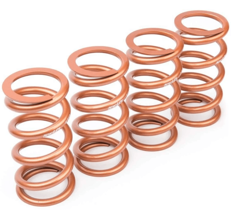 Set of four copper-colored coilover springs