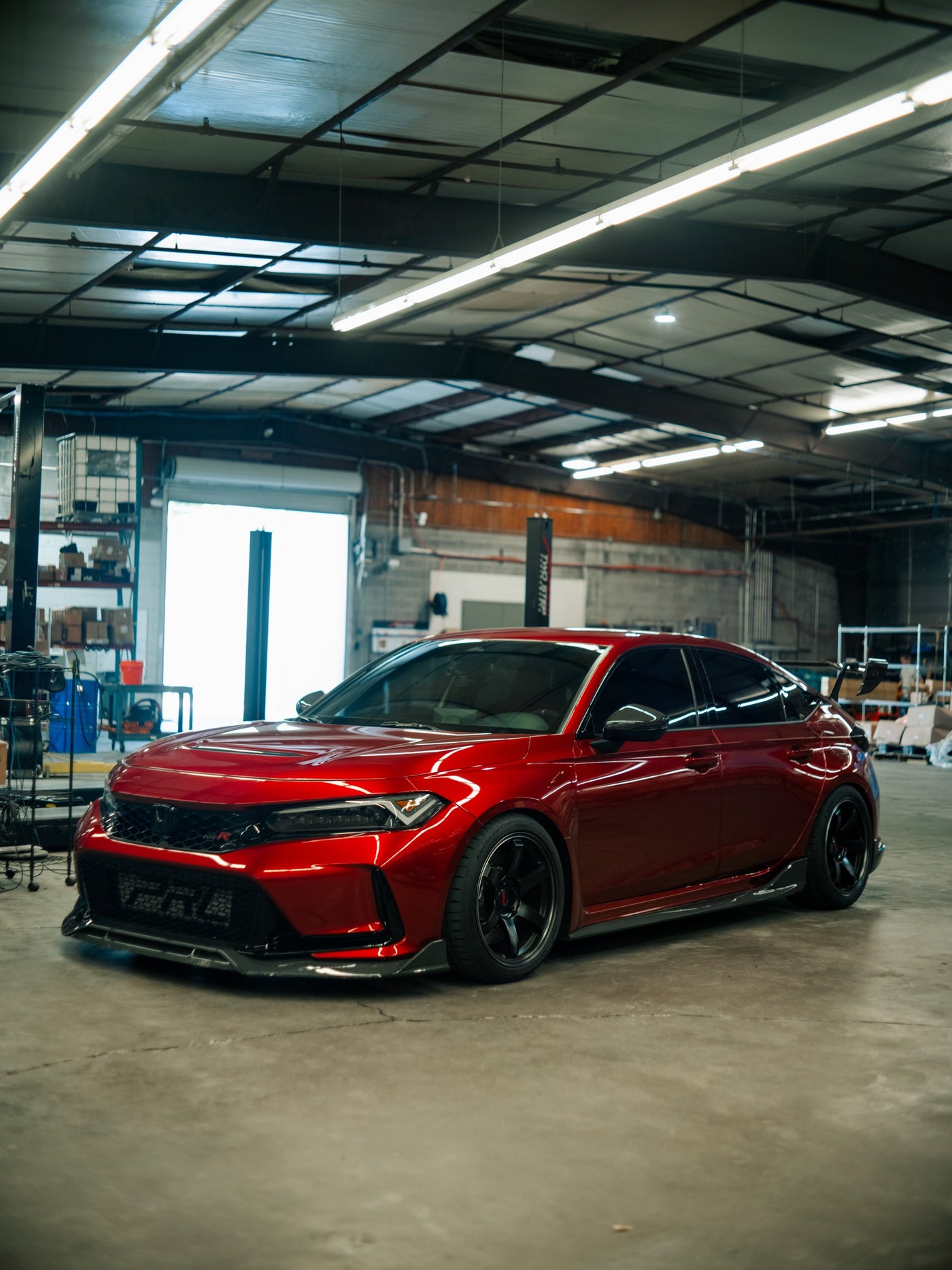The TSP FL5, Corey's 2023 Honda Civic Type R, in the shop wearing the Senko LED headlights