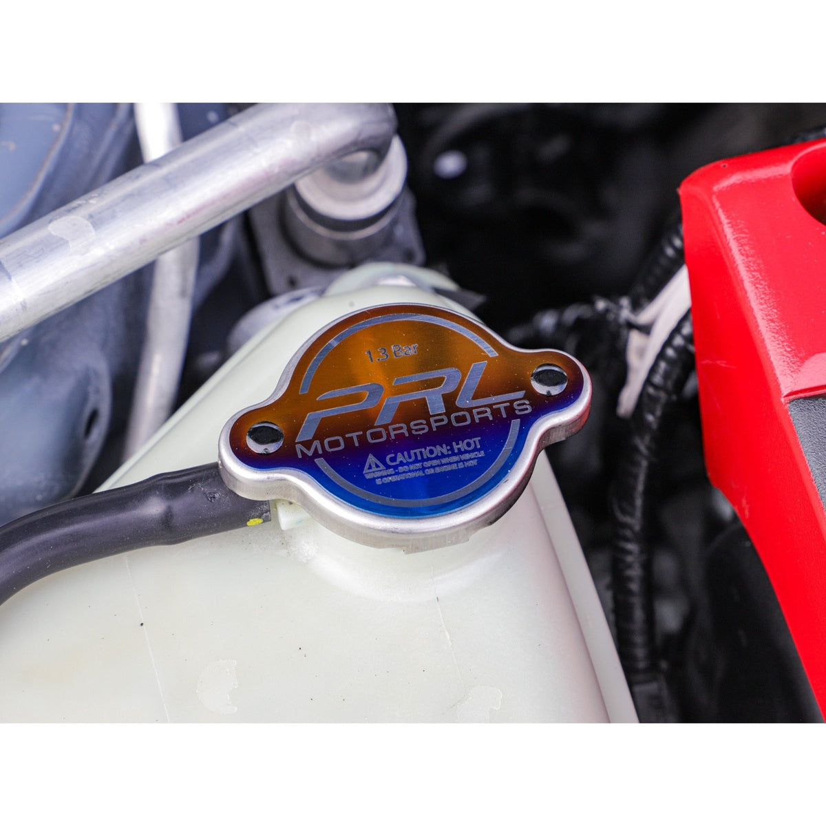 PRL titanium radiator cap installed on Honda reservoir