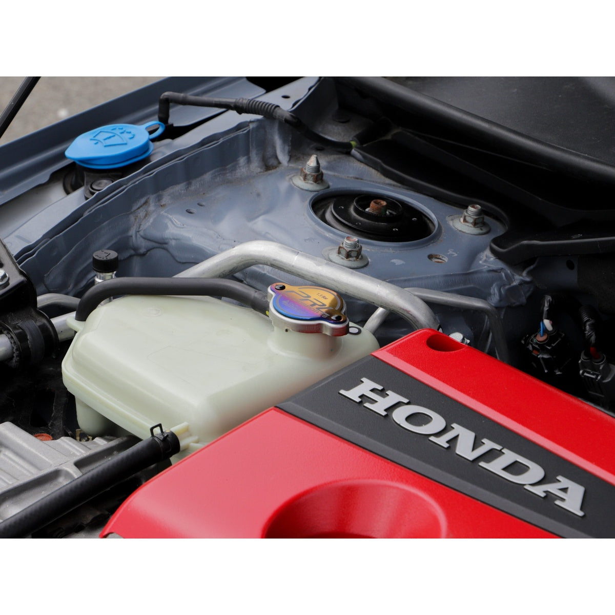 Passenger-side engine bay angle showing PRL radiator cap