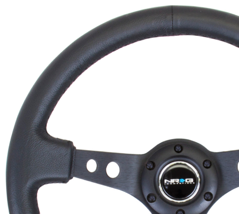 NRG Reinforced Steering Wheel (350mm / 3in. Deep) Blk Leather w/Blk Spoke & Circle Cutouts
